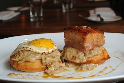 At Eleven in the Strip District, the brunch mainstay is called the Breakfast Dish:  waffles, chicken gravy, pork belly, fried egg and maple.
