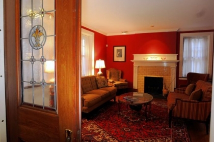 Pocket doors with added stained glass lead into the living room of the Lagneses' house in Highland Park.