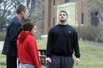 Seton Hill University students, from left, Dylan Everett, 18, Julia Chessa, 19, and Tyler Zimmer, 20, talk Saturday while on campus about the bus crash that had happened earlier in the day.