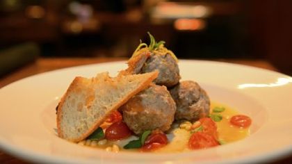 Polpette di vitello -- veal meatballs with tomatoes, pine nuts and lemon, is on the menu at Girasole.
