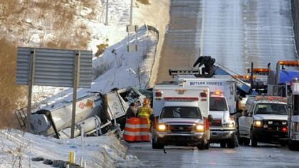 In one of many accidents Wednesday, crews try to recover a truck that skidded off Route 422 westbound near Butler. The road was closed until the accident was cleared.