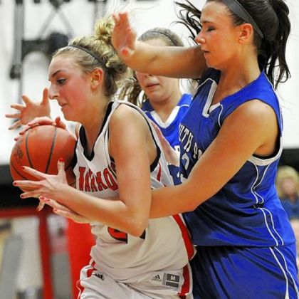 Junior forward Natalie Fekula, getting fouled by South Park's Breanna Raymond during a game last year, averages 10 points per game for Elizabeth Forward.
