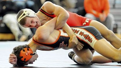 Bethel Park's Michael Vogel, bottom, and Peters Township's Tyler Buckiso wrestle at 126 pounds Wednesday afternoon in at match at Bethel Park.
