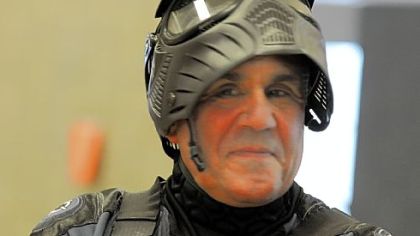 Officer Marc Muffi, left, wears his helmet.