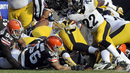 The Steelers' Chris Rainey scrambles for a touchdown at the end of the first quarter in a game at Cleveland in November.
