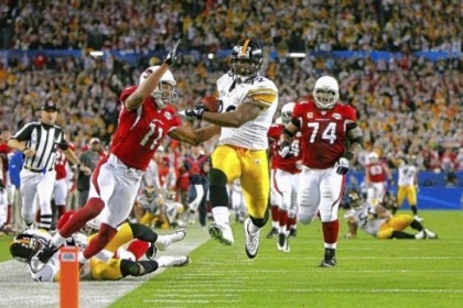 James Harrison scores a touchdown after running back an interception for 100 yards in the second quarter against the Arizona Cardinals during Super Bowl XLIII on February 1, 2009 at Raymond James Stadium in Tampa, Florida.